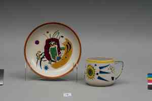CUP AND SAUCER WITH ABSTRACT COMPOSITIONS Painting design: Vassily Kandinsky 1923 Porcelain painted in overglaze colours Cup: height - 7 cm; Saucer: D - 14 cm