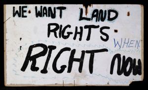 Land rights placard frm the aboriginal Tent embassy, erected, as a site of protest, in 1972.  Paint on Masonite board,  Old Parliament House, Canberra, Australia, 1972.   National Museum of Australia